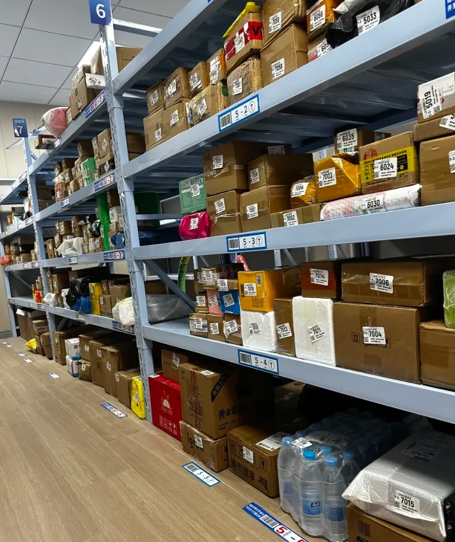Cartons and small stock items on identified warehouse shelves