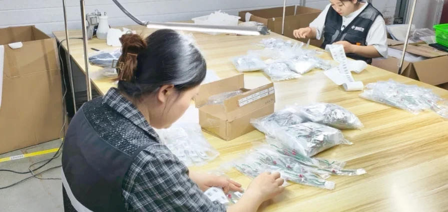 A team member preparing items at a packing bench