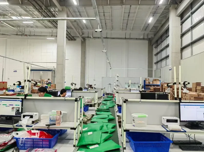 Warehouse packing workstations and parcel handling areas